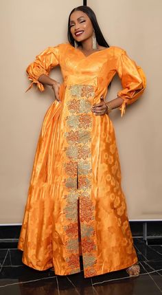 Description: This African  BROCADE  dress is perfect for any occasion you want to look your best.  PROCESSING: We usually take 4-5 BUSINESS DAYS to make the dress. SHIPPING: We use DHL shipping with tracking and text updates. (3 to 5 days) SIZING: What we need from you We have a sizing Chart in the images. Scroll to the right. (Providing your desired measurements for proper fitting ) BUST WAIST HIP SHOULDER SLEEVE LENGTH ARMHOLE Shoulder to waist Length of dress from shoulder to hem Length of skirt/wrapper from the waist to hem HEIGHT (Contact us if you need our custom measurements form ) Care Recommend: Machine wash cold / No bleach/Dry Clean/ Line dry Kindly note that due to variations in computer monitors, tablets, and/or mobile device settings, actual fabric colors may slightly differ Traditional Long Sleeve Midi Dress For Party, Traditional A-line Party Dress, Traditional Fitted Midi Dress For Party, Orange Silk Dress For Formal Occasions, Formal Orange Silk Dress, Elegant Orange Silk Dress, Traditional Festive Midi Dress For Party, Orange Long Sleeve Formal Dress, Orange Maxi Length Dress For Wedding