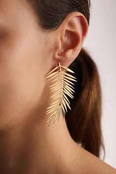 "The \"Palm Leaves Statement Lightweight Earrings\" are a stunning piece of jewelry that combines the elegance of 925 Sterling Silver with the luxurious warmth of 14k Gold Filled accents, creating a striking accessory perfect for those who appreciate nature-inspired designs. These earrings are not just a fashion statement but also a testament to exquisite craftsmanship and thoughtful design, offering wearers a touch of tropical elegance. Below is a detailed description of these beautiful earring Leaf-shaped Single Earring As A Gift, Leaf-shaped Wedding Jewelry For Pierced Ears, Elegant Leaf-shaped Jewelry For Party, Elegant Leaf-shaped Party Jewelry, Leaf-shaped Wedding Jewelry With Matching Earrings, Handmade Leaf-shaped Jewelry For Wedding, Handmade Leaf-shaped Earrings For Weddings, Handmade Leaf-shaped Wedding Earrings, Earrings Design