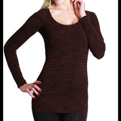 One Of Our Personal Favorites, This Long Ssleeve Zebra Print Top Comes In A Very Stretchy Fabric That Can Stretch To Any Size. The Boatneck Neckline Shows Off Your Shoulders And Elongates Your Neck Making You Appear Slimmer And Taller. Perfect Layering Piece For All Seasons. Can Be Worn Off The Shoulder Or As A Boatneck Top. 92% Nylon 8% Spandex Fitted Tiger Print Top For Fall, Casual Stretch Tiger Print Tops, Trendy Long Sleeve Tiger Print Tops, Casual Fitted Top With Tiger Print, Black Tiger Print Long Sleeve Tops, Black Long Sleeve Tiger Print Tops, Fitted Black Tiger Print Top, Black Long Sleeve Top With Tiger Print, Trendy Long Sleeve Zebra Print Tops