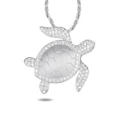 Alamea Sterling Silver CZ Turtle Pendant with Chain Necklace In Hawaii, the sea turtle is a symbol of good luck and protection. This beautiful sterling silver turtle pendant design from Alamea features sparkling CZ accents and comes with a cable chain so it's ready to wear right out of the box. Pendant measures approx. 15/16"L x 15/16"W Cable chain necklace measures approx. 16"L with 1" extender Stamped .925 Sterling silver turtle pendant has round, clear CZ accents Rhodium-plated Lobster-claw c Elegant Sterling Silver Turtle Jewelry, Elegant Silver Turtle Jewelry, Sterling Silver Turtle Necklace For Gifts, Silver Turtle Jewelry For Gifts, Silver Turtle Jewelry Gift, Sterling Silver Turtle Jewelry Gift, Turtle Shaped Sterling Silver Jewelry Gift, Sterling Silver Turtle Necklace For Gift, Silver Turtle Jewelry