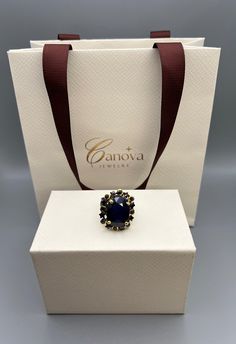 Add a touch of elegance to your wardrobe with this stunning handmade cocktail ring from Canova Jewelry. The oval-shaped blue sapphire stone is set in 925 sterling silver, giving it a timeless and classic look. The ring is perfect for any occasion, whether it's a special event like Mother's Day or Graduation, or an everyday accessory. The ring is nickel-free, making it safe and comfortable to wear. It features excellent cut grade and the natural creation of the gemstone adds to its unique beauty. The ring is a size 8. With its Art Deco era and bohemian theme, this ring is a perfect addition to any jewelry collection. Elegant Tanzanite Rings With Gemstone Accents, Elegant Cabochon Sapphire Ring, Luxury Sapphire Rings For Evening, Elegant Cabochon Sapphire Ring For Formal Occasions, Formal Cabochon Sapphire Ring, Luxury Sapphire Ring With Center Stone For Gift, Elegant Formal Cabochon Sapphire Ring, Elegant Formal Sapphire Cabochon Ring, Formal Sapphire Ring With Oval Cabochon