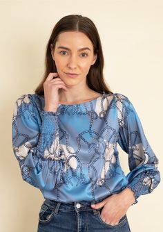 Introducing our Abigail Saddlery Print Blouse, where timeless equestrian elegance meets modern versatility. Featuring a classic silhouette, this blouse is designed to let the intricate Saddlery Print take center stage. With elasticated cuffs, flattering sleeves, and a scoop neckline, it effortlessly combines comfort with style. Perfect for pre-fall, this blouse shines in a classic color palette, making it an ideal pairing with white denim, jeans, or shorts. Embrace the understated beauty of eque Luxury Blue Formal Blouse, Luxury Blue Blouse For Formal Occasions, Fitted Blue Blouse With Blouson Sleeves, Elegant Blue Tops For Formal Occasions, Elegant Blue Top For Formal Occasions, Elegant Blue Formal Tops, Elegant Blue Fitted Blouse, Elegant Fitted Blue Blouse, Classic Color Palette