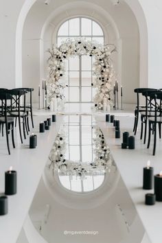 the interior of a building with tables and chairs