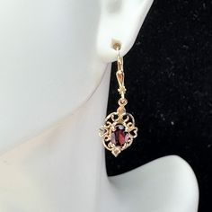 A Pair Of Mid-Century Orante 9 Yellow Gold Lady Earrings. Featuring An Oval Cut Natural Bohemia Garnet, 6.8 X 3.7mm, Prong Setting On A Filigree Scroll Etching Frame. Lever Back Earring Back. Hanging Length 1 1/4" X 11mm, Weight 2.0gm, Hallmark 375 Earring Backs, Gold Yellow, Oval Cut, Prong Setting, Etching, Hallmark, Garnet, Women's Earrings, Dangle Earrings