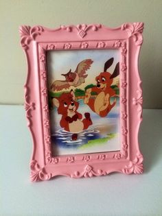 a pink frame with some cartoon characters on it