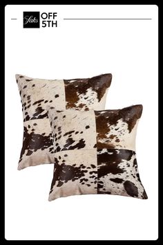 two brown and white pillows with black spots on the sides, one is made out of cow