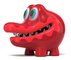 a red plastic toy with big eyes and teeth