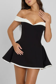 Meet our newest obsession - the Ramona Dress. A modern spin on a timeless silhouette, this black babydoll mini dress is made to turn heads and make memories in. This one-of-a-kind dress is made to hug your body in all the right places but enhancing your silhouette at the waistline and adding gathering at the hips for a flirty, flared fit. This stunning piece features double layered contrast hemline and matching contrasting white off shoulder sleeves. Gown Dress For Women, Black Babydoll, Babydoll Mini Dress, 2 Piece Skirt Set, Long Sleeve Knitted Cardigan, Fall 24, Dresses Elegant, Gown Dress, Feminine Look