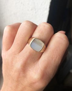 White Polished Signet Ring For Formal Occasions, Formal White Signet Ring With Polished Finish, White Rectangular Jewelry With Polished Finish, Classic White Opal Ring With Polished Finish, Rectangular White Jewelry With Polished Finish, Modern 14k Gold Moonstone Ring For Formal Occasions, Modern White Opal Gemstone Ring, Modern White Opal Ring, Luxury White Rectangular Ring