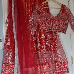 Beautiful Red Color Heavy Netted Sequence Work Lehenga Choli. Lehenga Comes With Lining And Cancan.And Heavy Beautiful Tassels. Blouse Has 3/4 Sleeves.And Back Buttons. Bust Size-36” To 38”( Extra 2” Margin) Lehenga Length-39” Heavy Netted Dupatta. Perfect For Weddings. Picture For Reference. Fitted Red Lehenga For Eid, Party Sets With Red Resham Embroidery, Red Embroidered Sharara For Party, Red Semi-stitched Sets With Intricate Embroidery, Red Choli With Resham Embroidery For Party, Floor-length Red Traditional Wear For Navratri, Red Floor-length Traditional Wear For Festivals, Red Choli For Festive Party, Red Choli For Party And Festive Occasions