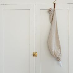 an umbrella hanging on the side of a white door