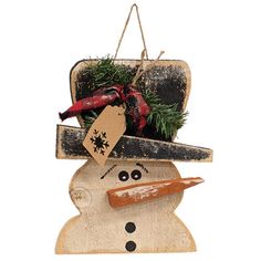 a wooden snowman ornament with a hat on top