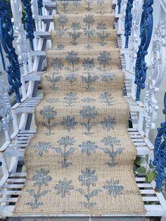 a set of stairs with blue flowers on them