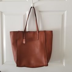 Jcrew Leathertote English Chestnut Brown Approximately 13" Tall, 12" Wide, 5.5" Deep Magnetic Closure Two Leather Side Ties To Adjust Shape & Size Large Interior Zipper Pouch Approximately 7.5" Tall X 9" Wide 10" Handle Drop Nwot Casual Workwear Bags With Leather Lining, Casual Brown Bag For Workwear, Casual Brown Bag For Work, Brown Shoulder Bag For Fall Workwear, Chestnut Brown Color, Chestnut Brown, Magnetic Closure, Zipper Pouch, Chestnut