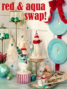 a table topped with christmas decorations and plates