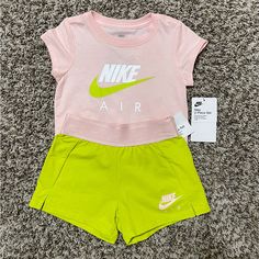 Light Pink Shirt And Matching Shorts, Shirt Is Made With Soft Knit Fabric And Shorts Have An Elasticized Waistband For Comfortable Fit, Size 4, Color Atomic Green, 60% Cotton 40% Polyester, New With Tags!! Cute Pink Crew Neck Sets, Casual Green Nike Sets, Nike Pink Short Sleeve Sets, Playful Pink Nike Sets, Nike Pink T-shirt For Summer, Nike Pink Playwear Sets, Sporty Pink Sets For Summer, Sporty Pink Sets For Spring, Pink Casual Playwear Sets