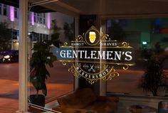 a window with a sign that says gentlemen's on it