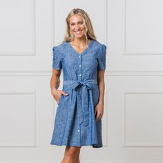 Our beautiful short sleeve chambray dress is a year-round staple that works in warm and cool weather alike. Made from soft organic cotton chambray, this button-down dress features a flattering v-neck, sculpted seaming at the bodice, and a removable waist sash for versatile styling. We have a feeling this is a piece you'll go back to time and time again. 100% Organic Cotton, exclusive of trims. Garment is 100% GOTS-Certified Organic. Learn more about our certifications here. Button front closure. Waist Sash, Cool Weather, Beautiful Shorts, Chambray Dress, Button Down Dress, Romper Dress, Sweater And Shorts, Dress Romper, Quality Clothing