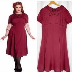 Step Back Into The Glamorous World Of The 1950s With This Stunning Hell Bunny Vixen Retro Style Party Dress In Burgundy! Perfect For Any Occasion, From Parties To Cosplay Events, This Dress Is Designed To Fit And Flatter Any Figure With Its Fit And Flare Style. The Dress Is Made From High-Quality Materials And Is In Very Great Condition, Never Used. The Dress Features A Sailor-Style Collar, Adding A Touch Of Vintage Charm To The Overall Look. The Beautiful Burgundy Colour Is Perfect For Any Seas Red 1950s Style A-line Vintage Dress, Vintage Short Sleeve Dress For Costume Party, 1950s Style Vintage Dress For Events, Retro Red Dress For Costume Party, Retro Vintage Short Sleeve Party Dress, Retro Short Sleeve Vintage Dress For Party, Retro Short Sleeve Vintage Party Dress, Retro Vintage Dress For Retro-themed Events, Vintage Dress For Retro-themed Events