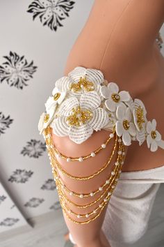 Bridal shoulder epaulette embellished with off-white lace and  pearls and glass beads with pearl tassel You can use it both in your wedding dress and on the shoulder of your evening dress. You can order the epaulette with pin or ribbon. There is a transparent sequin and pearl detail on the ribbon. If you chose the ribbon option, please let me know the size of the ribbon Lace size:  9 inch  lenght  x  3 inch     ( 23cm x 8cm )  Pearl tassel lenght:  3.5 inch  ( 9 cm ) ♥Thank you for supporting handmade art to wear by an independent designers♥ Pearl Dress Design, Fitted White Bridal Accessories With Pearl Embroidery, Embellished Shoulder Pads, Wedding Epaulettes, Pearl Shoulder Jewelry, Beaded Shoulder Pads, Pearl Shoulder Chain, Beaded Sleeves, Beaded Fashion