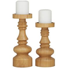 two wooden candlesticks sitting next to each other