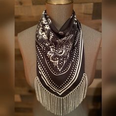 This stunning black color silky bandana is perfect for any stylish cowgirl out there. Adorned with dazzling rhinestone accents, it's sure to catch the eye of anyone who sees it. The fringe adds a touch of western flair, making it a great accessory for any outfit.  Whether you're headed to a rodeo, country concert or just out for a night on the town, this bandana is the perfect choice. Bandana measures 27.5 inches x 27.5 inches Fabric is 100% polyester  Please feel free to contact me with any questions. Black Bohemian Scarves With Bandana Print, Black Bandana With Bandana Print For Festivals, Western Bling, Rhinestone Fringe, Country Concerts, Country Concert, Bandanas, Rodeo, Black Color