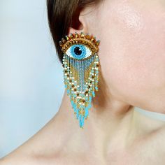 "Large evil eye earrings with beaded fringe. The upper part is embroidered with Czech seed beads, Japanese seed beads, crystal beads, gimp wire. The reverse side of the earring is made of faux leather. Beaded threads hang down below.  Stainless steel earring stud. This material is very wear-resistant, does not rust, does not oxidize, does not darken. Also, stainless steel does not cause allergies. The length of the earrings is 9.7cm (3.8\"), eye width 3.7cm (1.4\"), with eyelashes 4.3cm (1.7\"). Stainless Steel Earrings Studs, Embroidery Earrings, Red Heart Earrings, Evil Eye Earrings, Earring Stud, Eye Earrings, Beaded Fringe, Earring Patterns, Bead Embroidery