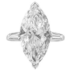 This breathtaking three-stone ring highlights a 4.26 carat marquise-cut diamond as its centerpiece, exuding elegance and brilliance. Crafted in platinum, the setting provides durability and a luxurious finish. Certified by GIA, the diamond is graded E in color, offering a near colorless and luminous appearance. A VS1 diamond with minor inclusions, which are hard to notice without magnification, ensuring high clarity and a dazzling shine. The Very Good polish enhances the diamond's surface, creat Flawless Diamond Ring, Oval Diamond Solitaire Ring, Marquise Solitaire Ring, Single Diamond Ring, Marquise Cut Diamond Ring, Oval Diamond Solitaire, Contemporary Engagement Rings, Marquise Diamond Ring, Marquise Ring