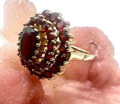 ELEGANT GARNET ring 333.GOLD 8K. In the Middle Ages, garnets were known as "carbuncle stones" and were charged with meaning. They stood for the glow of love and were carried with them as talismans. The origin of this word is Latin: "Carbunculus" means something like small, sparkling or red-hot coal and describes the shimmering red garnet, which develops its mysterious, deep color especially in sunlight. The Offered Ring Revel in the opulent, deep red shine of the garnets with which this beautifu Red Garnet Ring, The Middle Ages, Garnet Jewelry, Garnet Ring, With Meaning, Golden Girl, The Glow, Garnet Rings, Deep Colors