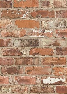 an old brick wall that has been painted red and brown with white paint on it