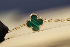 Indulge in the opulent elegance of our CLOVER 20 MOTIFS MALACHITE DIAMOND GOLD NECKLACE. Crafted with 20 stunning motifs adorned with malachite and diamonds, this necklace exudes luxury and sophistication. Elevate any outfit with this exclusive piece that embodies the beauty of art and fashion. ADDITIONAL INFORMATION Color: Gold Stone: Malachite, Cubic Zirconia Ref. vcarp34806 Material:- 925 Sterling Silver - 18k Gold Plated- 18k Real Gold ( contact us via instagram) Length of chain : 84cm Our r Gold Gemstone Necklace In Elegant Style, Elegant Gold Gemstone Necklaces, Elegant Gold Jewelry With Gemstone, Elegant Gold Gemstone Necklace, Elegant Green Jewelry With Polished Finish, Elegant Green Plated Jewelry, Luxury Gold Jeweled Jewelry, Elegant Yellow Gold Jewelry With Jewels, Elegant Green 14k Gold Necklace