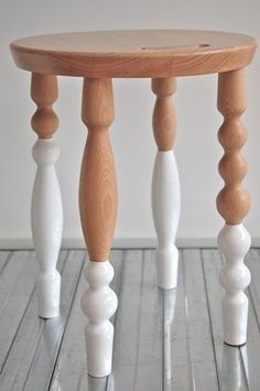 a small wooden table sitting on top of a hard wood floor