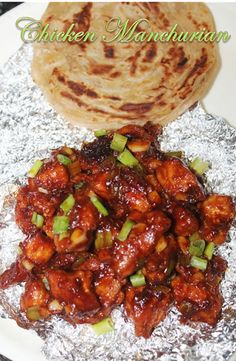 chicken and vegetable dish served on aluminum foil with pita bread