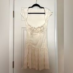 Never Worn. Would Be Cute For Summer Vacation Or Engagement Party Cream Ruched Dress For Vacation, Casual Cream Mini Dress For Party, Casual Cream Party Dress, Cream Casual Party Dress, Fitted Cream Mini Dress For Beach, Fitted Cream Mini Dress For Vacation, Fitted Cream Mini Dress For The Beach, Casual Cream Ruched Mini Dress, Ruched Short Sleeve Dresses