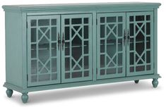 a blue cabinet with glass doors on the top and bottom, in front of a white background