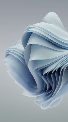 an abstract blue paper sculpture on a gray background