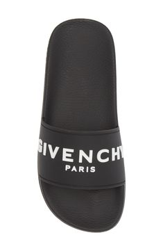 A bold Givenchy logo stamp crosses the wide strap of cushy, water-friendly sliders. Synthetic upper, lining and sole Made in Italy Women's Designer Shoes Designer Slides With Branded Insole For Beach, Designer Beach Slides With Branded Insole, Designer Slides For Summer, Luxury Beach Slides With Rubber Sole, Designer Beach Slides With Cushioned Footbed, Logo Print Slip-on Sandals For Summer, Slip-on Sandals With Logo Print For Summer, Luxury Black Slides For The Beach, Luxury Black Slides For Beach