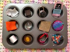 a muffin tray filled with lots of different items