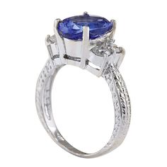 Stamped: 14K White Gold Total Ring Weight: 5.2 Grams Ring Length: N/ARing Width: N/A Gemstone Weight: Total Natural Tanzanite Weight is 3.54 Carat (Measures: 11.10x8.40 mm) Color: Blue Diamond Weight: Total Natural Diamond Weight is 0.65 Carat Quantity: 4 Color: F-G, Clarity: VS2-SI1 Face Measures: 11.10x13.80 mm Sku: [702279W] 14k White Gold Diamond Ring, Tanzanite Diamond Ring, White Gold Diamond Rings, Gold Diamond Ring, Natural Tanzanite, Blue Diamond, White Gold Diamonds, Gold Diamond, Natural Diamonds