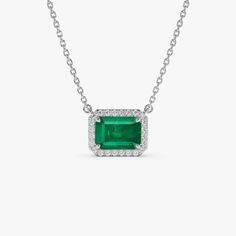 Gold Kt: 14K (also available in 18K) Available Gold Color: Yellow Gold Length and Width: 9.8 X 7.70 MM Round Diamonds: 24 PC 1.0 MM Octagon Emerald: 1 pc 7 x 5 MM Emerald Carat Weight: 1.02 ctw Diamond Carat Weight: 0.12 ctw Emerald Cut Platinum Gemstones In White Gold, Emerald Cut Diamond Fine Jewelry, Emerald Cut Platinum Gemstones For Gifts, White Gold Gemstone With Emerald Brilliant Cut, White Gold Emerald Cut Gemstones With Prong Setting, Gia Certified Octagon White Gold Jewelry, White Gold Necklace With Emerald Cut And Halo Setting, White Gold Emerald Cut Necklace With Halo Setting, Gia Certified Emerald Cut Fine Jewelry Necklaces