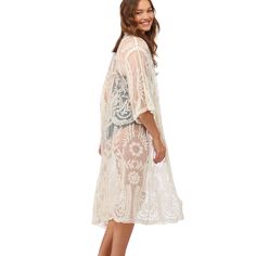 Crafted from semi sheer embroidered lace and cotton crochet, this knee-length kimono is perfect to wear as a cover up or dress up any outfit by wearing this over it. Semi-sheer embroidered lace nylon Cotton crochet accent One Size Fits Most Material: NYLON/COTTON Bohemian Lace Beach Cover-up, Spring Festival Lace Cover-up, Lace Open Front Cover-up For Summer, White Sheer Cover-up For Spring, White Lace Cover-up For Spring, Bohemian Lace Patchwork Summer Cover-up, Crochet Lace Cover-up For Vacation, Flowy Lace Dress With Lace Sleeves, Bohemian Crochet Lace For Spring