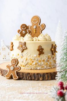 there is a cake decorated with gingerbreads and icing