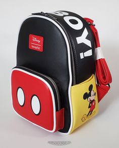 This is a Loungefly Disney Mickey Mouse "Oh Boy!" mini backpack.  Beautiful and durable pebbled black, red and yellow faux leather with white piping.  This backpack has a wonderful image of Mickey printed on the right side pocket, "OH BOY!" on the top panel and Mickey's buttons on the front pouch.  Hardware is pewter color and the bag is lined in a  solid black color. Dimensions: 10.5"H x 9”W x 4.5”D This item is new...not pre-owned.  Impeccable condition - only removed for photos.  The backpack Mickey Mouse Loungefly Backpack, Mickey Clothes, Cartoon Items, Stitch Shoes, Lounge Fly, Mickey Backpack, Disney Bags Backpacks, Original Mickey Mouse, Backpack Purses