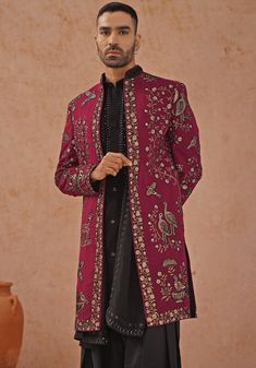 Elevate your style with Wine embroidered sherwani. Crafted from georgette, the sherwani showcases intricate cut dana, Swarovski, and pearl handwork. The handwork collar detailing adds an extra touch of elegance. Paired with a black kurta featuring embroidered yoke design, front hook closure, two pockets, and pure lining. Completed with patiyala pants and dupatta. Perfect for special occasions like Sangeet, Mehendi, or as a wedding guest outfit. Composition : Sherwani, Kurta, Patiyala Pant & Dupa Long Sleeve Sherwani With Cutdana For Reception, Reception Sherwani With Cutdana And Long Sleeves, Designer Embroidered Sherwani For Festive Occasions, Designer Bandhgala With Resham Embroidery, Traditional Festive Outerwear For Reception, Traditional Outerwear For Receptions And Festivals, Traditional Outerwear For Festivals And Receptions, Traditional Festival Outerwear For Reception, Designer Kurta With Intricate Embroidery For Reception