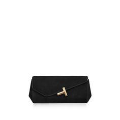 Inspiring, empowering and above all, unwavering, the Tiffany T collection reminds us of the connections we feel but cannot always see. This Tiffany T clutch is crafted in goat suede with gold-plated brass hardware. It features a slip pocket, a small mirror pocket, a magnet closure and a Tiffany T logo on the front. Black goat suede; Gold-plated brass hardware; One slip pocket and one small mirror pocket; Magnet closure; 5.1" H x 11.4" L x 2.2" W | Tiffany T Clutch in Black Suede Black Goat, Tiffany T, Small Mirror, T Logo, Gold Handbags, Small Mirrors, Black Accessories, Airport Fashion, Gold Leather