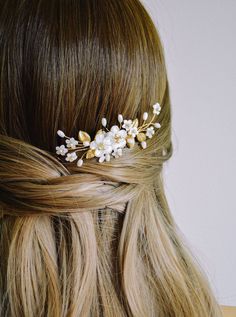 "Delicate and feminine, the Ettie floral bridal hair comb makes a perfect finishing touch to a romantic bridal look. Whether tucked into the side of a chic chignon or adorning soft, loose curls, this heirloom comb will add a hint of old-world elegance. DETAILS * Measures 10 cm. (4\") long and 3 cm. (1.25\") across widest point. * Hand-wired Swarovski pearls and Mother of Pearl beads. * Carved Mother of Pearl flowers. * Available in gold as shown or silver. * Handmade in Canada. PRODUCTION This c Nontraditional Wedding Ideas, Gold Wedding Hair Accessories, Soft Updo, Gold Hair Accessories Wedding, Floral Bridal Hair, Wedding Headpieces, Floral Comb