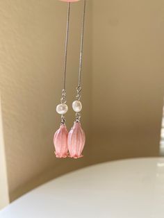 A beautiful and unique botanical inspired earrings features pink lily flower bud.  Wear them to reflect your love for the nature and art! These pendants makes a great gift for Christmas birthdays, Valentine's Day, and Mother's day. Pink Birth Flower Dangle Jewelry, Elegant Pink Flower Earrings In Sterling Silver, Elegant Pink Sterling Silver Flower Earrings, Delicate Flower Charm Earrings, Feminine Flower Decorated Earrings For Gift, Feminine Handmade Flower Earrings For Gift, Handmade Flower Earrings As Feminine Gift, Handmade Feminine Flower Earrings For Gifts, Rose Gold Flower Earrings As Gift