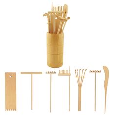 the wooden utensils are arranged in a cup and on top of each other