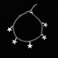 Handmade stainless steel bracelet with 5 stainless steel Star charms. Each charm measures around 9mm. The high-grade stainless steel chain, charms and findings are hypoallergenic, durable, waterproof and won't tarnish. The standard length is 16cm + 4cm extender chain. Total length is 20cm. If you want a different length please leave a note during checkout so I can make it especially for you! Every item will always be gift-wrapped in a cute organza gift bag, carefully packaged to arrive safely. T Silver Stainless Steel Chain Bracelet With Charms, Silver Stainless Steel Jewelry With Star Charm, Metal Charm Bracelet With Star Charm, Celestial Silver Charm Bracelet, Silver Celestial Bracelet With Star Charm, Star-shaped Stainless Steel Jewelry With Adjustable Chain, Silver Star-shaped Adjustable Chain Bracelet, Silver Celestial Star Charm, Stars Bracelet