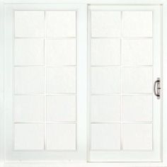 a white double door with glass panels on the outside and side doors open to let in light